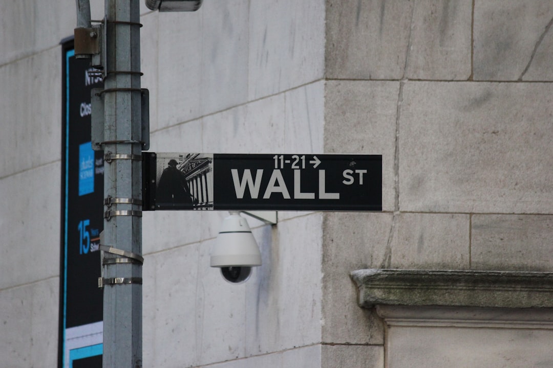 A street sign on the corner of wall street