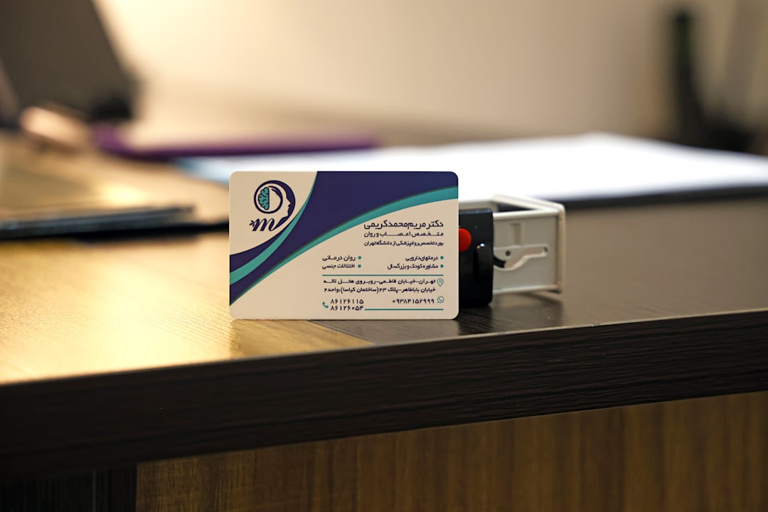 Business card and stamp on a desk