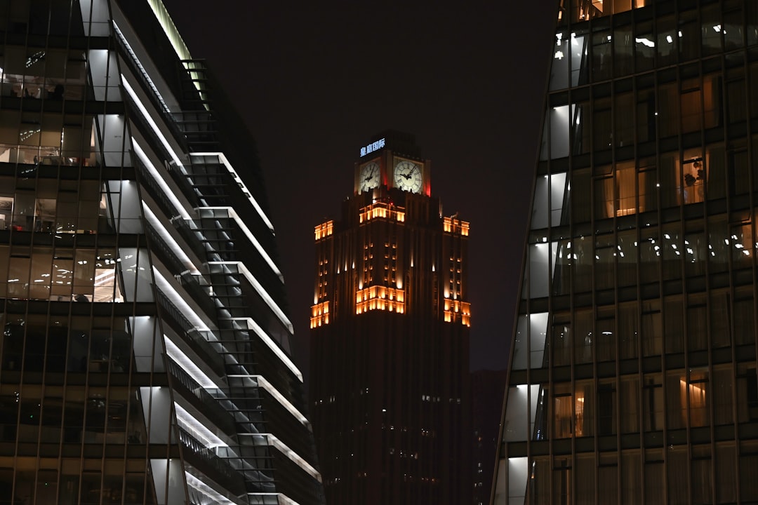 Illuminated skyscrapers at night with dark sky